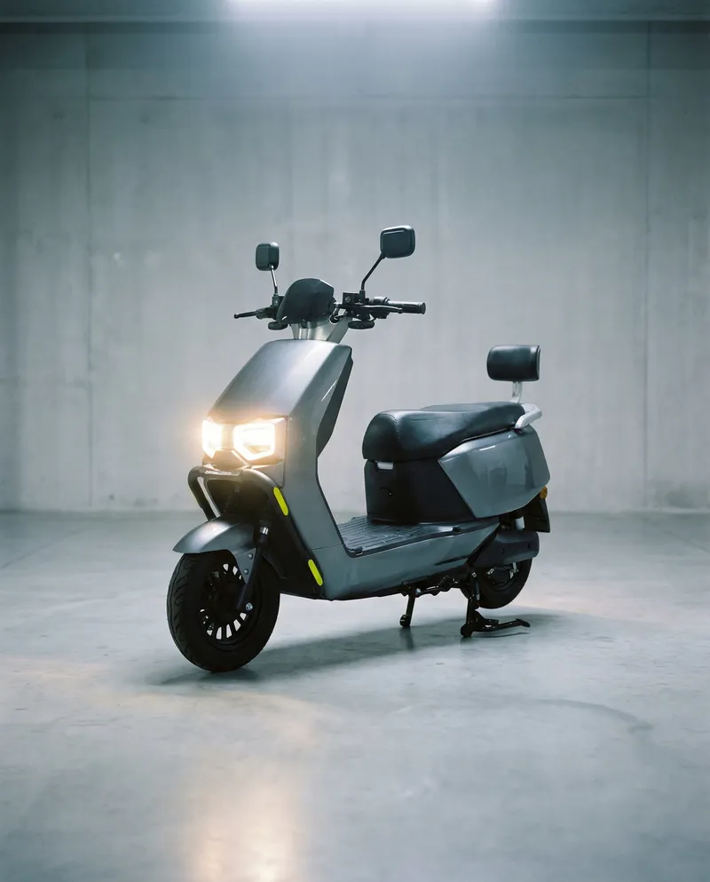 EVE E10 with its LED headlights on, front disc brake and alloy wheels in view