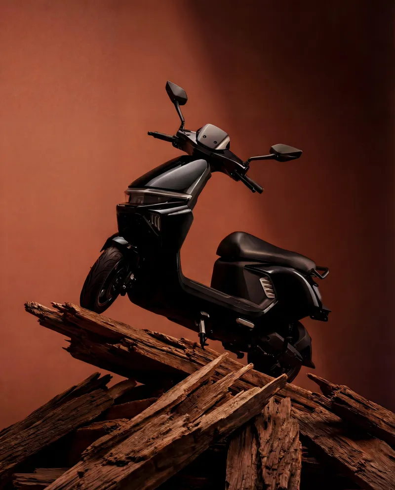 EVE E20 electric scooter in Graphite finish, dark studio shot