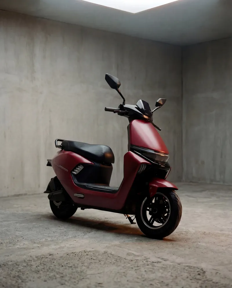 EVE E20 electric scooter in deep Maroon finish